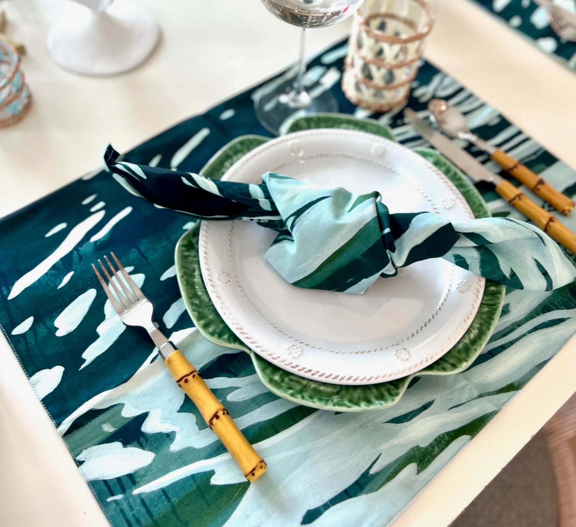 table
Deep blue, green with aqua overlay - placemats (reversible), napkins and runners. Art from Artist, Sarah Soule Webb